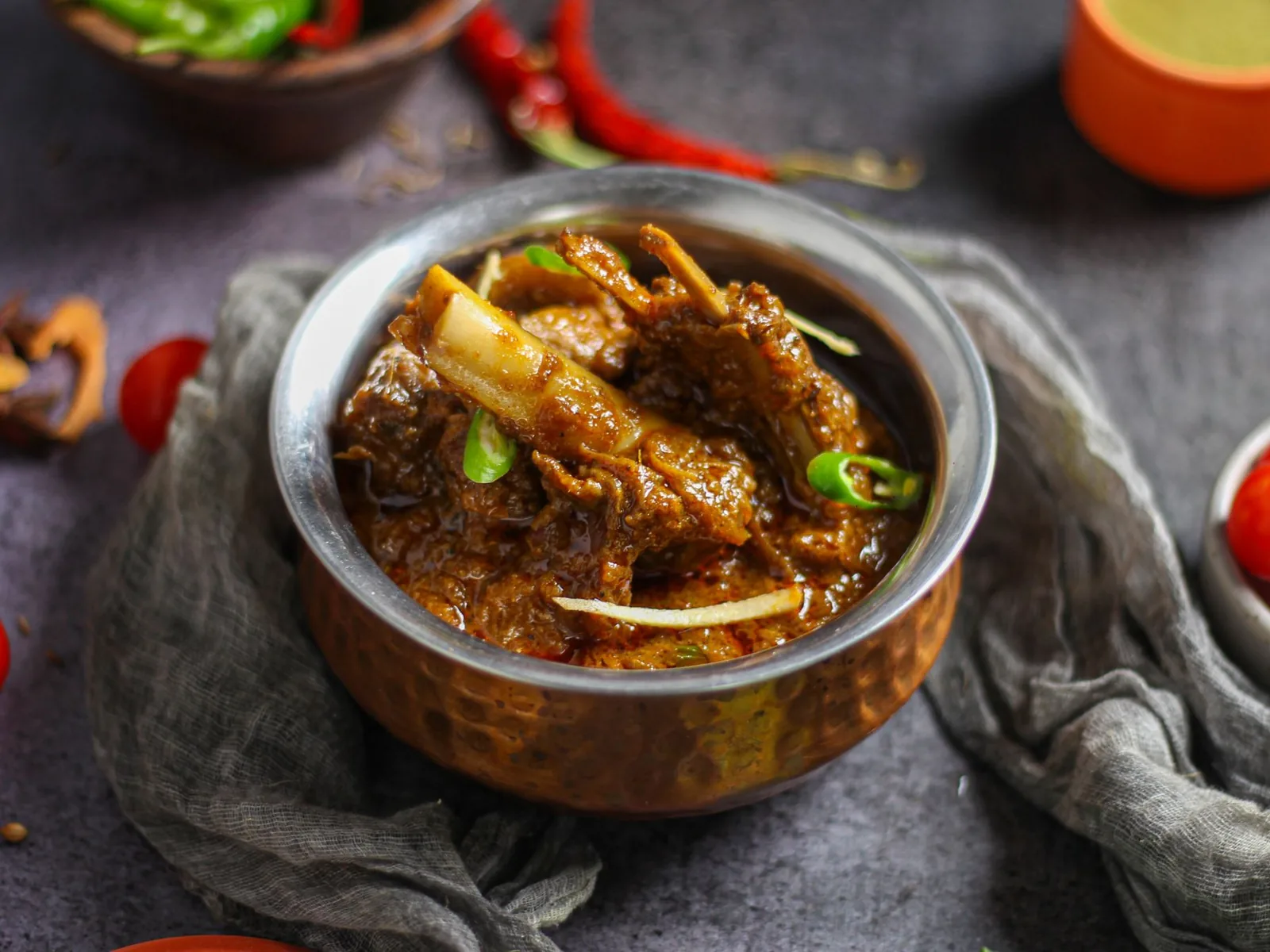 Mutton rogan josh in a copper bowl
